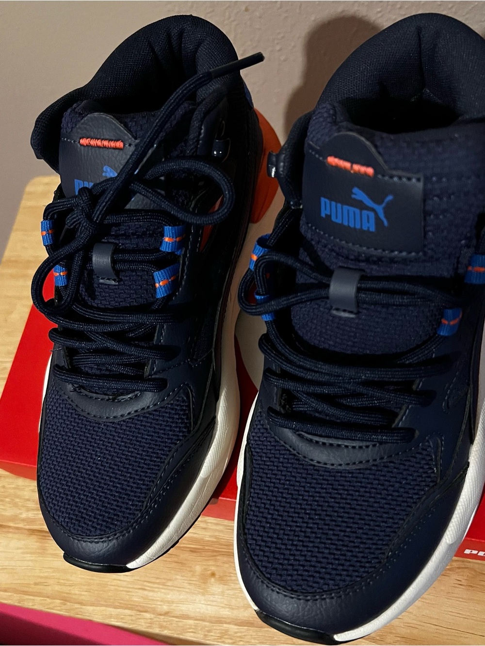 Puma Navy Blue High-Top Athletic Sneakers with Orange Accents